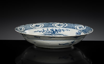 Lot 161 - A LARGE SWATOW BLUE AND WHITE ‘PHEASANTS AND DUCKS’ BRACKET-LOBED CHARGER, 16TH CENTURY