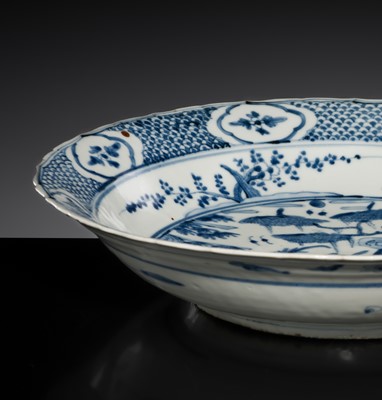 Lot 161 - A LARGE SWATOW BLUE AND WHITE ‘PHEASANTS AND DUCKS’ BRACKET-LOBED CHARGER, 16TH CENTURY