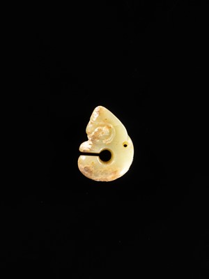 Lot 54 - A SMALL CELADON AND RUSSET JADE ‘PIG DRAGON’, ZHULONG, HONGSHAN CULTURE