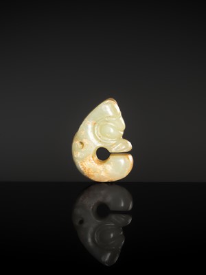 Lot 54 - A SMALL CELADON AND RUSSET JADE ‘PIG DRAGON’, ZHULONG, HONGSHAN CULTURE
