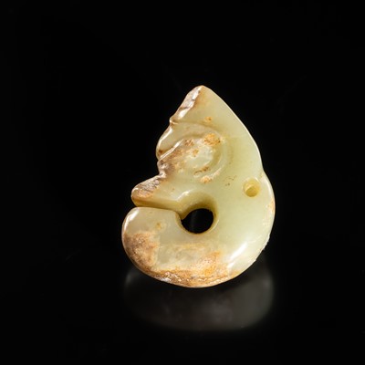 Lot 54 - A SMALL CELADON AND RUSSET JADE ‘PIG DRAGON’, ZHULONG, HONGSHAN CULTURE