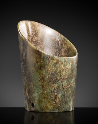 Lot 211 - A MOTTLED GREEN AND BROWN JADE ‘HORSE-HOOF’ ORNAMENT, HONGSHAN CULTURE