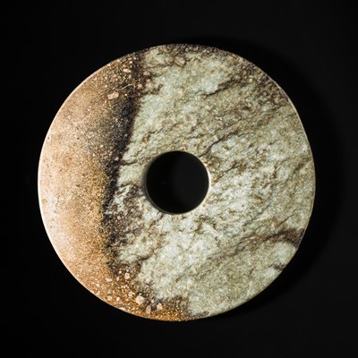 Lot 222 - A MOTTLED CELADON AND RUSSET JADE DISK, BI, NEOLITHIC PERIOD-EARLY BRONZE AGE