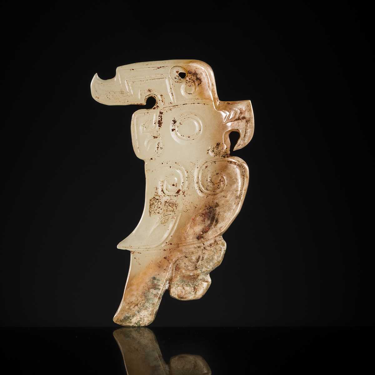 Lot 71 - A RARE PALE GREENISH-WHITE AND RUSSET JADE ‘BIRD’ PENDANT, LATE SHANG DYNASTY, 13TH-11TH CENTURY BC