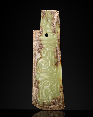 Lot 81 - A GREEN AND BROWN JADE ‘BIRDS AND DRAGON’ CEREMONIAL BLADE, WESTERN ZHOU DYNASTY