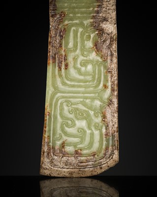Lot 81 - A GREEN AND BROWN JADE ‘BIRDS AND DRAGON’ CEREMONIAL BLADE, WESTERN ZHOU DYNASTY