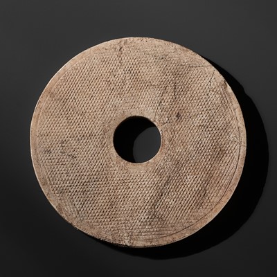 Lot 245 - A REDDISH-BROWN MARBLE DISC, BI, EASTERN ZHOU PERIOD
