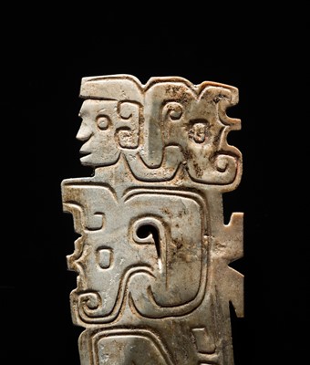 Lot 78 - A BROWN AND IVORY-WHITE JADE ‘HUMANOID-DRAGON’ PENDANT, MID-LATE WESTERN ZHOU DYNASTY