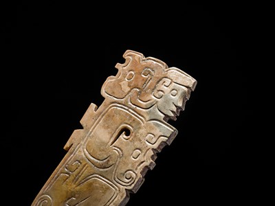 Lot 78 - A BROWN AND IVORY-WHITE JADE ‘HUMANOID-DRAGON’ PENDANT, MID-LATE WESTERN ZHOU DYNASTY