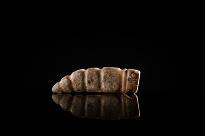 Lot 72 - A CELADON JADE ‘SILKWORM’ PENDANT, LATE SHANG DYNASTY