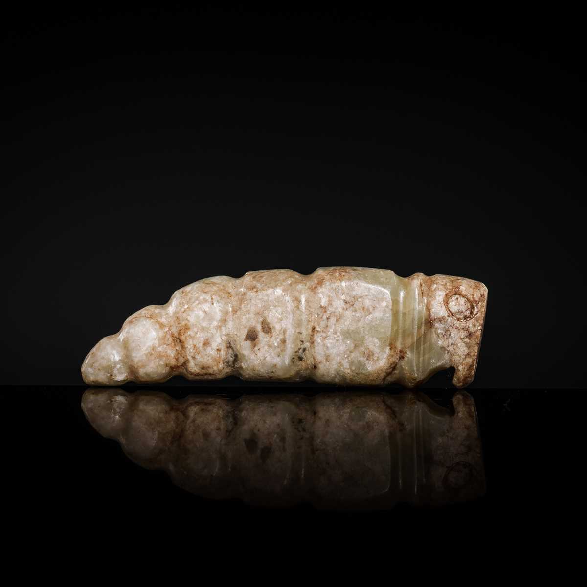 Lot 72 - A CELADON JADE ‘SILKWORM’ PENDANT, LATE SHANG DYNASTY