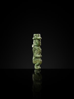 Lot 77 - AN EXCEPTIONAL GREEN JADE MAN-SHAPED SILHOUETTE PENDANT, MID-LATE WESTERN ZHOU PERIOD