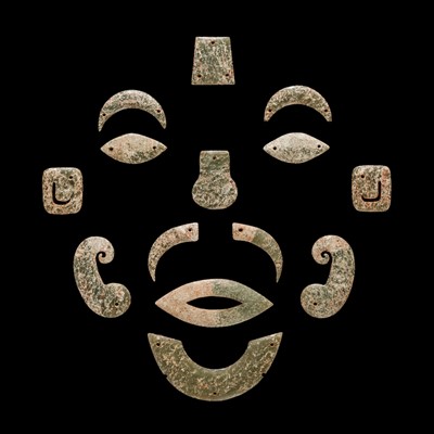 Lot 85 - A RARE GREEN JADE FUNERARY MASK, WESTERN ZHOU DYNASTY, 10TH CENTURY BC