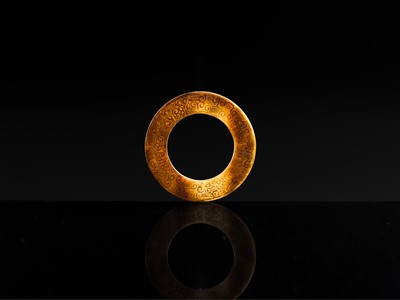Lot 84 - A SMALL YELLOW JADE ‘DRAGONS’ RING, HUAN, EASTERN ZHOU, SPRING AND AUTUMN PERIOD