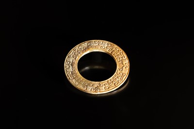 Lot 84 - A SMALL YELLOW JADE ‘DRAGONS’ RING, HUAN, EASTERN ZHOU, SPRING AND AUTUMN PERIOD