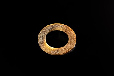 Lot 84 - A SMALL YELLOW JADE ‘DRAGONS’ RING, HUAN, EASTERN ZHOU, SPRING AND AUTUMN PERIOD