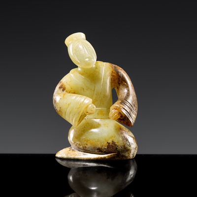 Lot 245 - A FINE CELADON AND RUSSET JADE KNEELING FIGURE, HAN DYNASTY