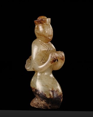 Lot 88 - A RARE CELADON AND BROWN JADE WINGED IMMORTAL, HAN DYNASTY