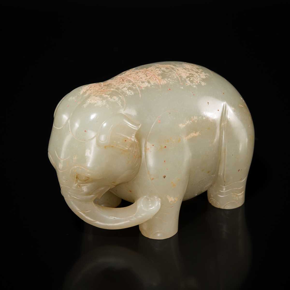 Lot 99 - AN OUTSTANDING AND EXTREMELY RARE CELADON JADE FIGURE OF AN ELEPHANT, HAN DYNASTY