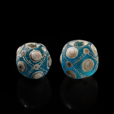 Lot 212 - A PAIR OF POLYCHROME GLASS ‘EYE’ BEADS, EASTERN ZHOU PERIOD