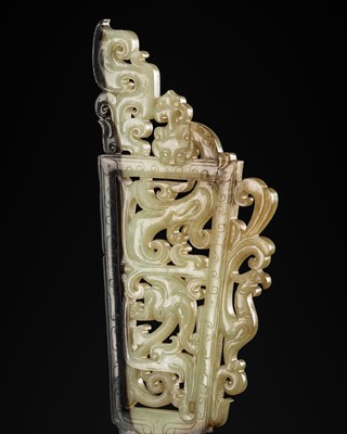 Lot 98 - A SUPERB CELADON AND BLACK JADE ‘CHILONG AND PHOENIX’ OPENWORK PLAQUE, HAN DYNASTY