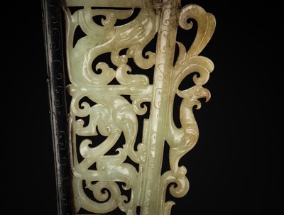 Lot 98 - A SUPERB CELADON AND BLACK JADE ‘CHILONG AND PHOENIX’ OPENWORK PLAQUE, HAN DYNASTY