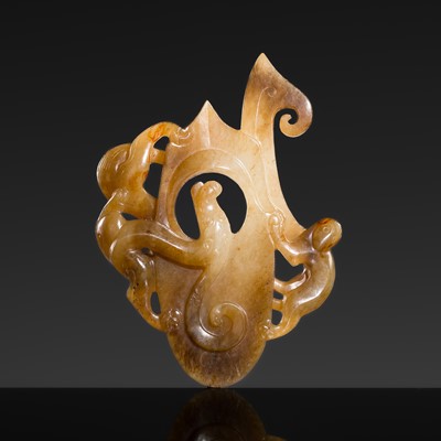 Lot 244 - A WHITE AND BROWN JADE ‘CHILONG’ ARCHER’S RING ORNAMENT, HAN DYNASTY