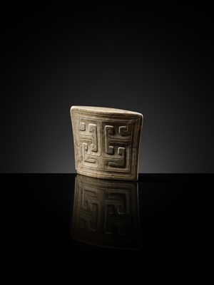 Lot 91 - A JADE ‘MASK’ SCABBARD CHAPE, WARRING STATES PERIOD TO HAN DYNASTY