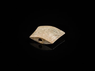 Lot 91 - A JADE ‘MASK’ SCABBARD CHAPE, WARRING STATES PERIOD TO HAN DYNASTY