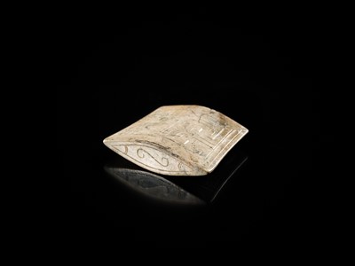 Lot 91 - A JADE ‘MASK’ SCABBARD CHAPE, WARRING STATES PERIOD TO HAN DYNASTY