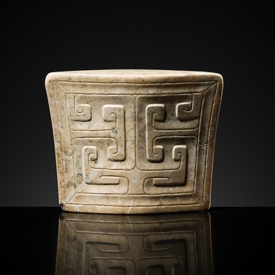 Lot 91 - A JADE ‘MASK’ SCABBARD CHAPE, WARRING STATES PERIOD TO HAN DYNASTY