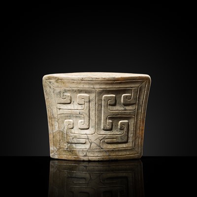 Lot 91 - A JADE ‘MASK’ SCABBARD CHAPE, WARRING STATES PERIOD TO HAN DYNASTY