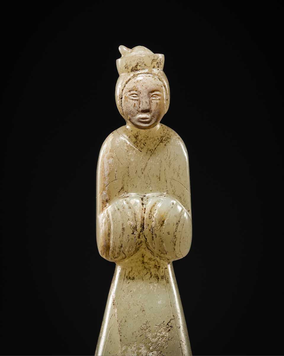 Lot 96 - AN EXCEEDINGLY RARE AND IMPORTANT GRAYISH-WHITE JADE FIGURE OF A COURT LADY, EARLY WESTERN HAN DYNASTY