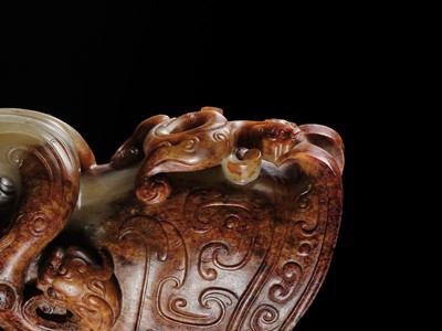 Lot 103 - AN EXCEPTIONAL AND IMPORTANT CELADON AND RUSSET ‘CHILONG’ RHYTON, HAN DYNASTY