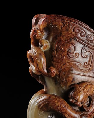 Lot 103 - AN EXCEPTIONAL AND IMPORTANT CELADON AND RUSSET ‘CHILONG’ RHYTON, HAN DYNASTY