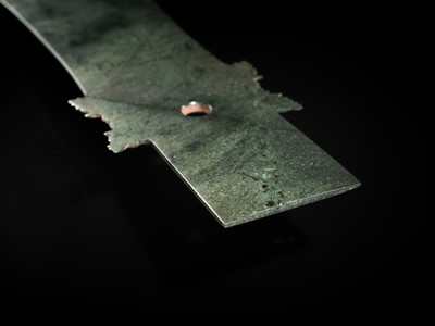 Lot 65 - A RARE AND VERY LARGE (48 CM) DARK GREEN JADE CEREMONIAL BLADE, YAZHANG, SHIMAO CULTURE