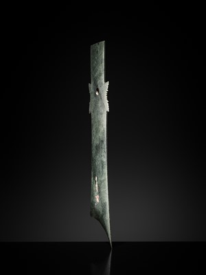 Lot 65 - A RARE AND VERY LARGE (48 CM) DARK GREEN JADE CEREMONIAL BLADE, YAZHANG, SHIMAO CULTURE