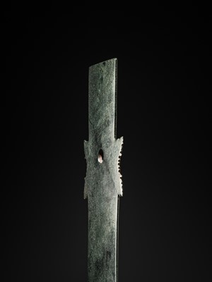 Lot 65 - A RARE AND VERY LARGE (48 CM) DARK GREEN JADE CEREMONIAL BLADE, YAZHANG, SHIMAO CULTURE