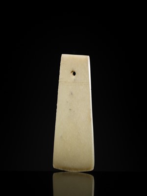 Lot 80 - A GREENISH-WHITE JADE CEREMONIAL AXE BLADE, YUE, LATE SHANG-WESTERN ZHOU DYNASTY