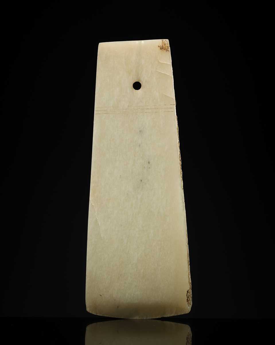 Lot 80 - A GREENISH-WHITE JADE CEREMONIAL AXE BLADE, YUE, LATE SHANG-WESTERN ZHOU DYNASTY