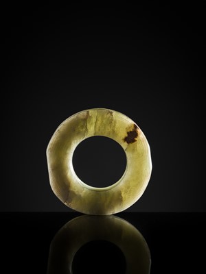 Lot 88 - A GREEN JADE ‘DRAGONS AND BIRDS’ RING-FORM PENDANT, EASTERN ZHOU DYNASTY