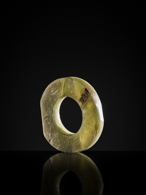 Lot 88 - A GREEN JADE ‘DRAGONS AND BIRDS’ RING-FORM PENDANT, EASTERN ZHOU DYNASTY