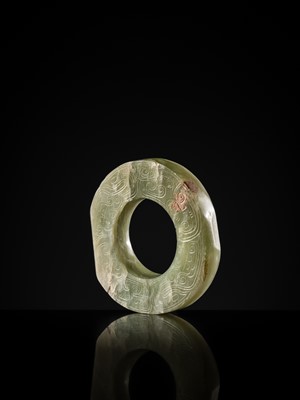 Lot 88 - A GREEN JADE ‘DRAGONS AND BIRDS’ RING-FORM PENDANT, EASTERN ZHOU DYNASTY