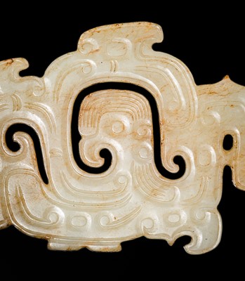 Lot 83 - A WHITE AND RUSSET JADE ‘PHOENIX AND DRAGONS’ OPENWORK PENDANT, WESTERN ZHOU DYNASTY