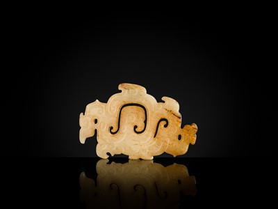 Lot 83 - A WHITE AND RUSSET JADE ‘PHOENIX AND DRAGONS’ OPENWORK PENDANT, WESTERN ZHOU DYNASTY