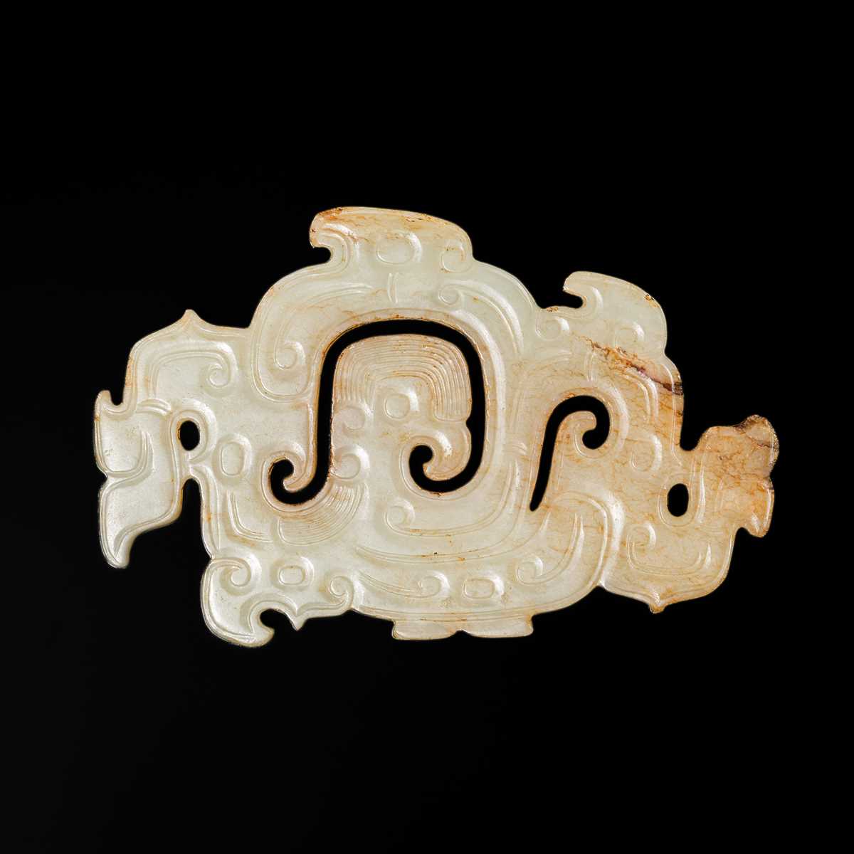 Lot 83 - A WHITE AND RUSSET JADE ‘PHOENIX AND DRAGONS’ OPENWORK PENDANT, WESTERN ZHOU DYNASTY