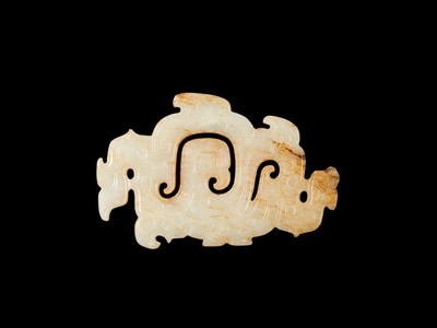 Lot 83 - A WHITE AND RUSSET JADE ‘PHOENIX AND DRAGONS’ OPENWORK PENDANT, WESTERN ZHOU DYNASTY
