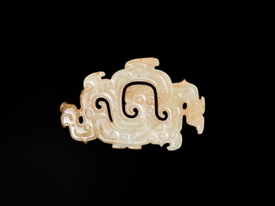 Lot 83 - A WHITE AND RUSSET JADE ‘PHOENIX AND DRAGONS’ OPENWORK PENDANT, WESTERN ZHOU DYNASTY