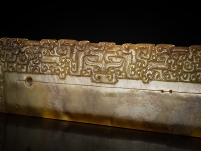 Lot 82 - A RARE BROWN JADE ‘ANIMAL MASK’ HARVESTING KNIFE, HU, SPRING AND AUTUMN PERIOD