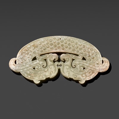 A FINE PALE CELADON JADE ‘DOUBLE DRAGON’ PENDANT, WARRING STATES PERIOD